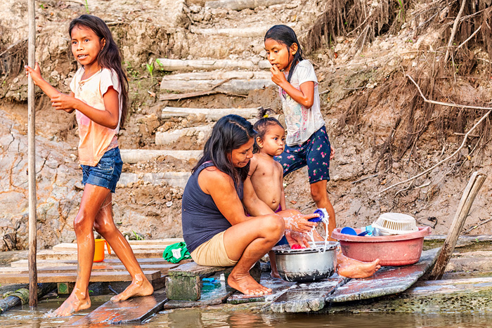 Robert Bolla – “The World Around Us-Peurvian Amazon Washing Dishes in the River” - https://fineartamerica.com/profiles/robert-bolla